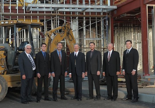 Bogard family members at a construction site.